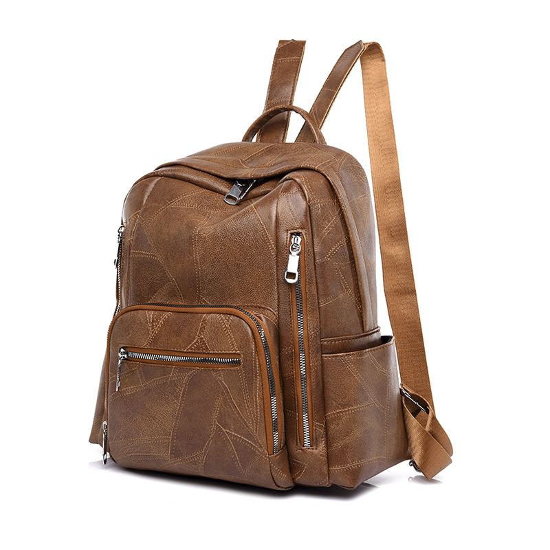 Sac à dos Femme Marron rétro en cuir, taille moyenne, avec plis décoratifs, ceinture et multiples poches intérieures pour un usage quotidien élégant.